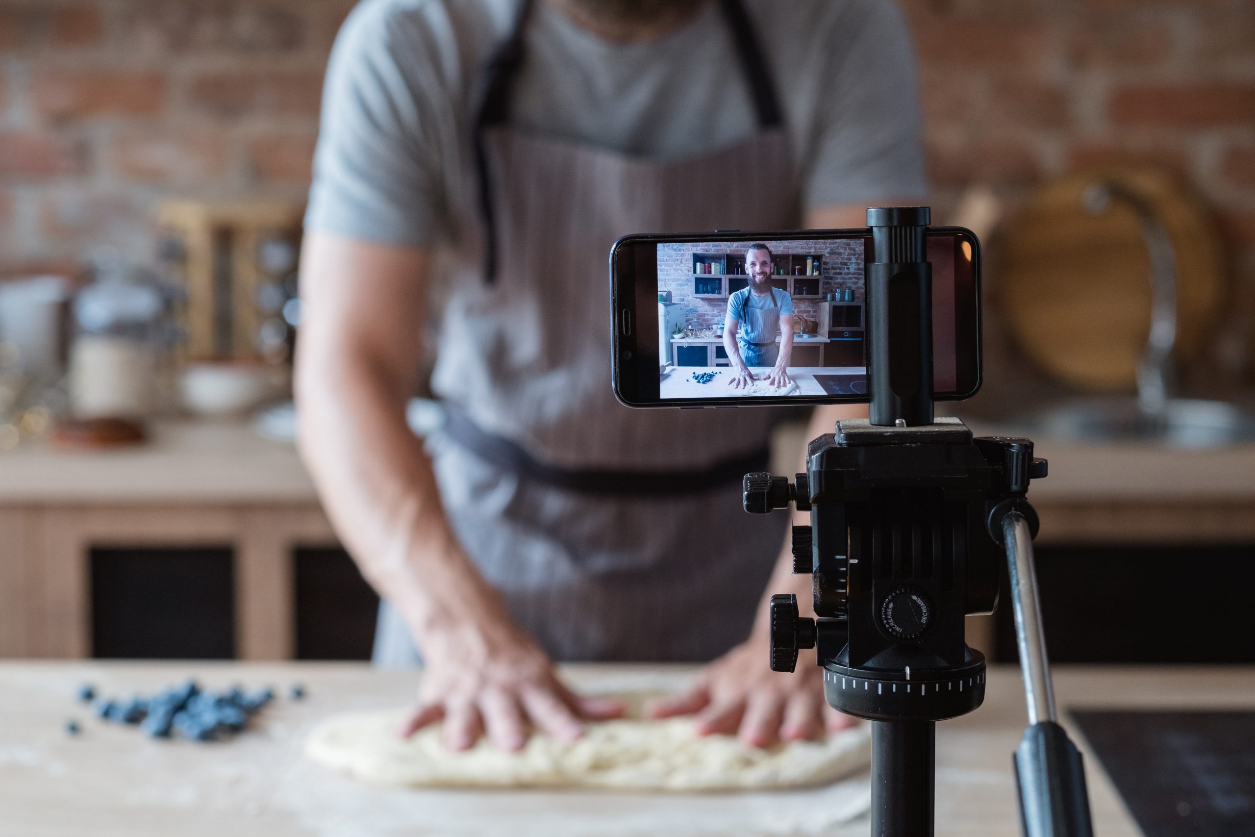 Man recording video of making dough