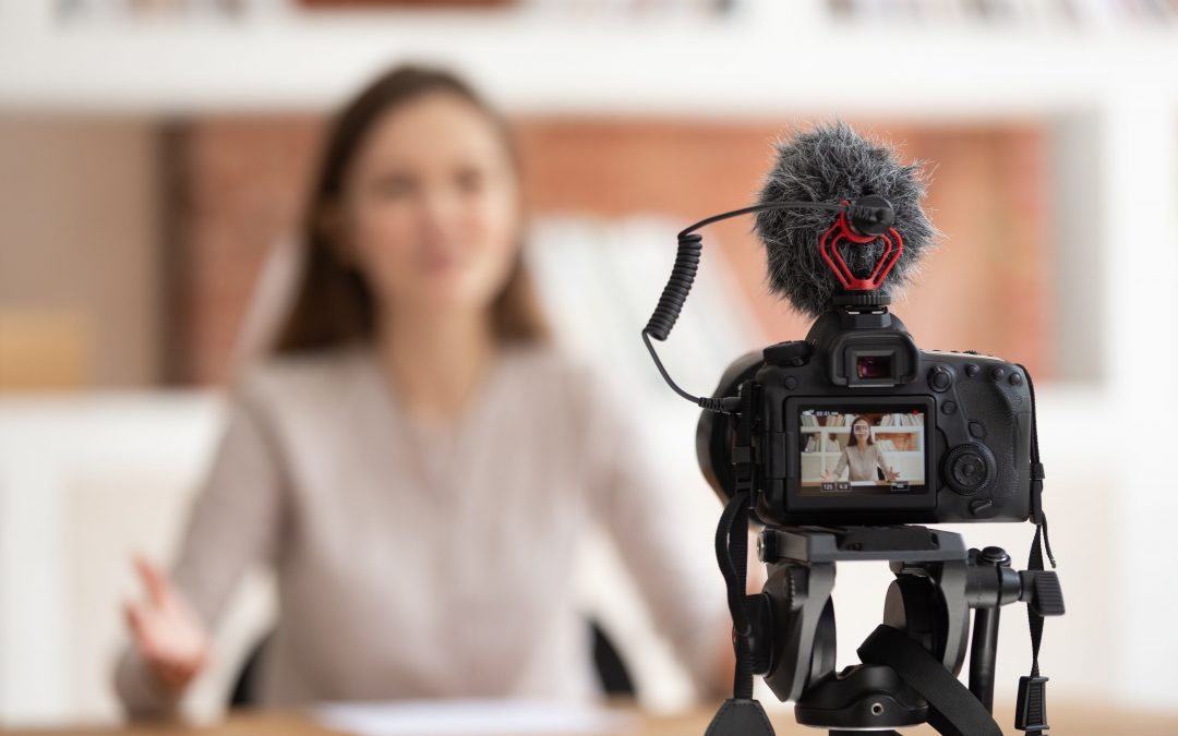 Woman recording self with video set up