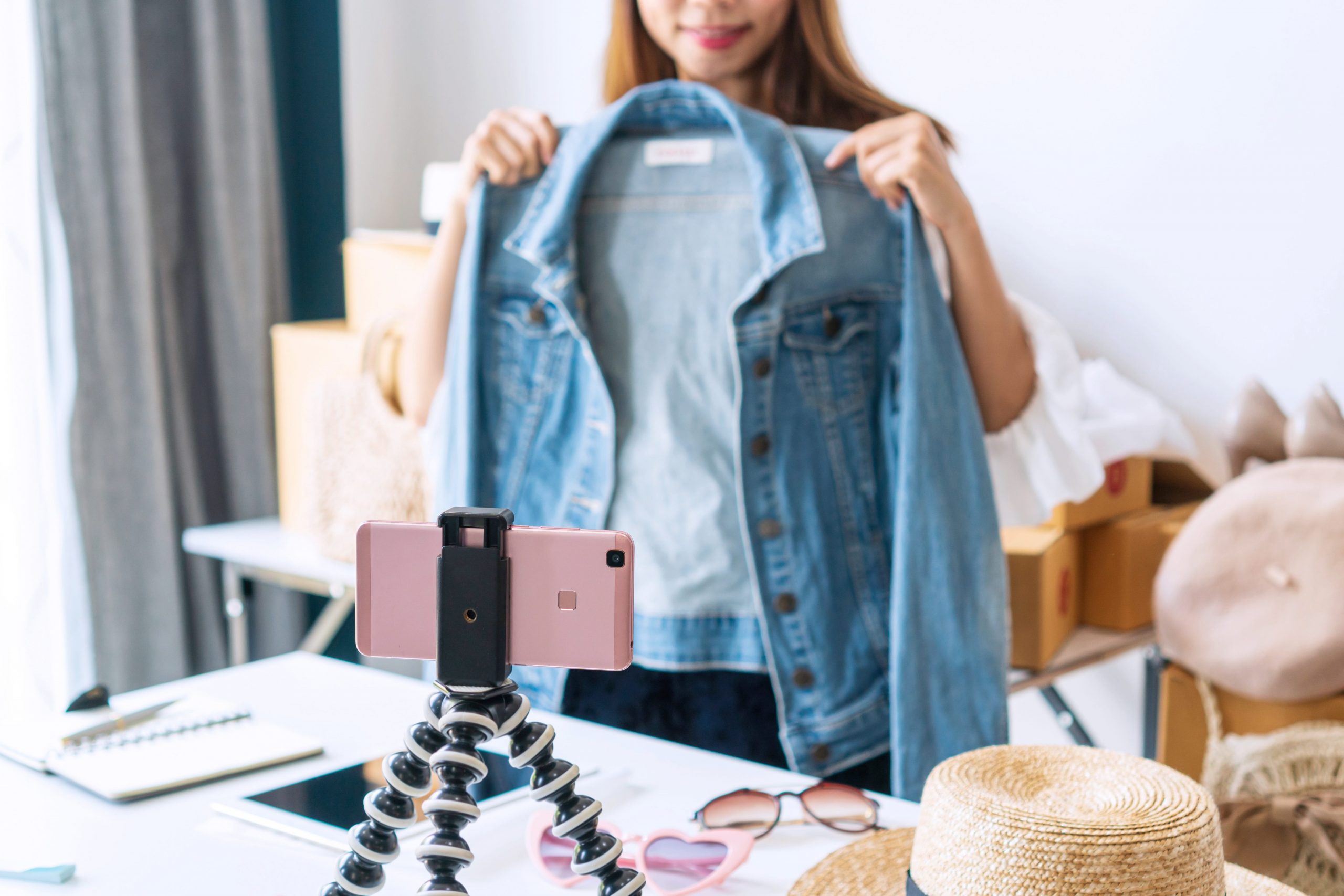 Girl showing off clothing via cell phone video