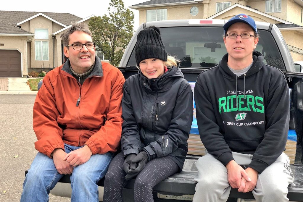 Volunteers In Back of Truck