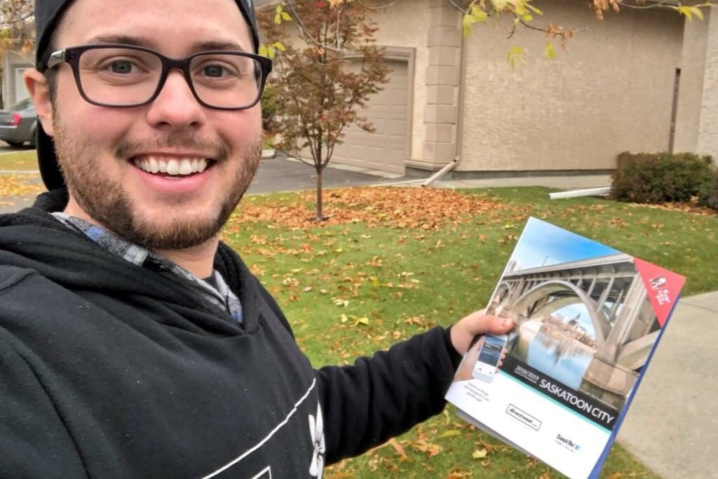 Saskatchewanderer holding Saskatoon phone book